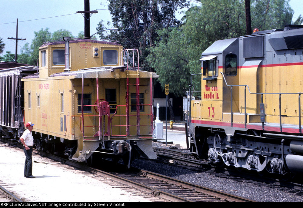 Union Pacific local conductor "rolls by" UP #73 west at the old Riverside Jct..